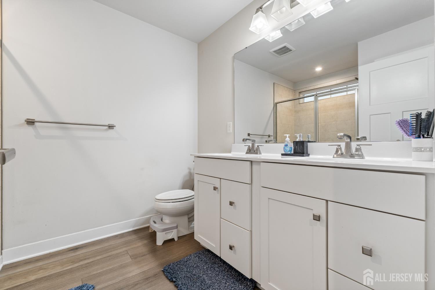 74 Anchor Way Cliffwood, NJ 07721 - Photo 18 of 35 a bathroom with a toilet a sink and mirror