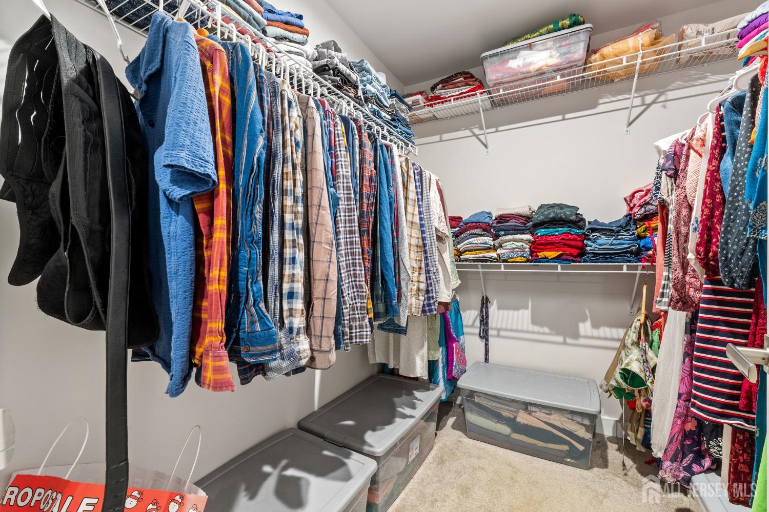 74 Anchor Way Cliffwood, NJ 07721 - Photo 20 of 35 a view of walk in closet with clothes and shoes