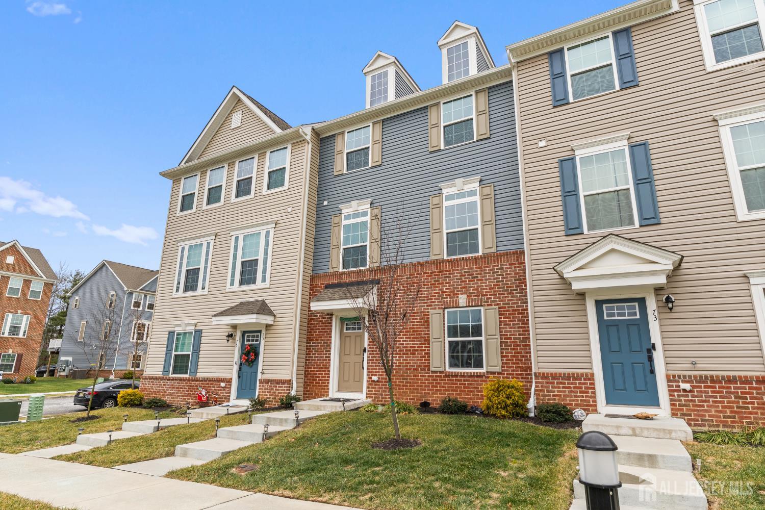 74 Anchor Way Cliffwood, NJ 07721 - Photo 2 of 35 a front view of a house with a yard