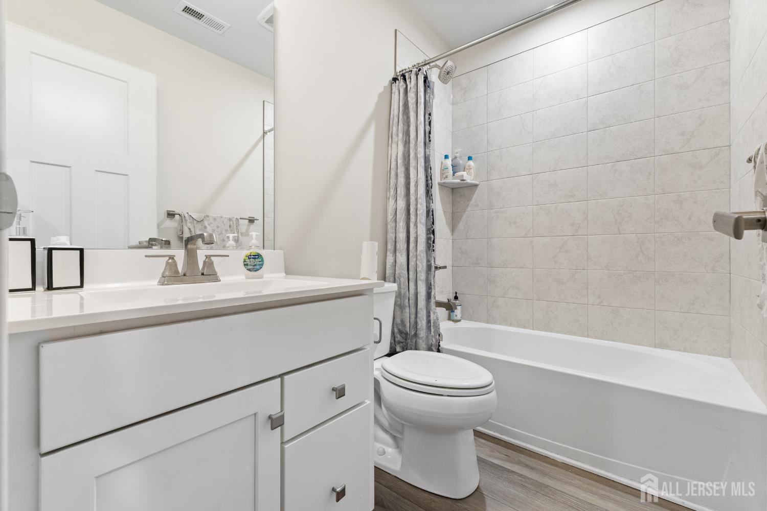74 Anchor Way Cliffwood, NJ 07721 - Photo 22 of 35 a bathroom with a sink toilet and shower