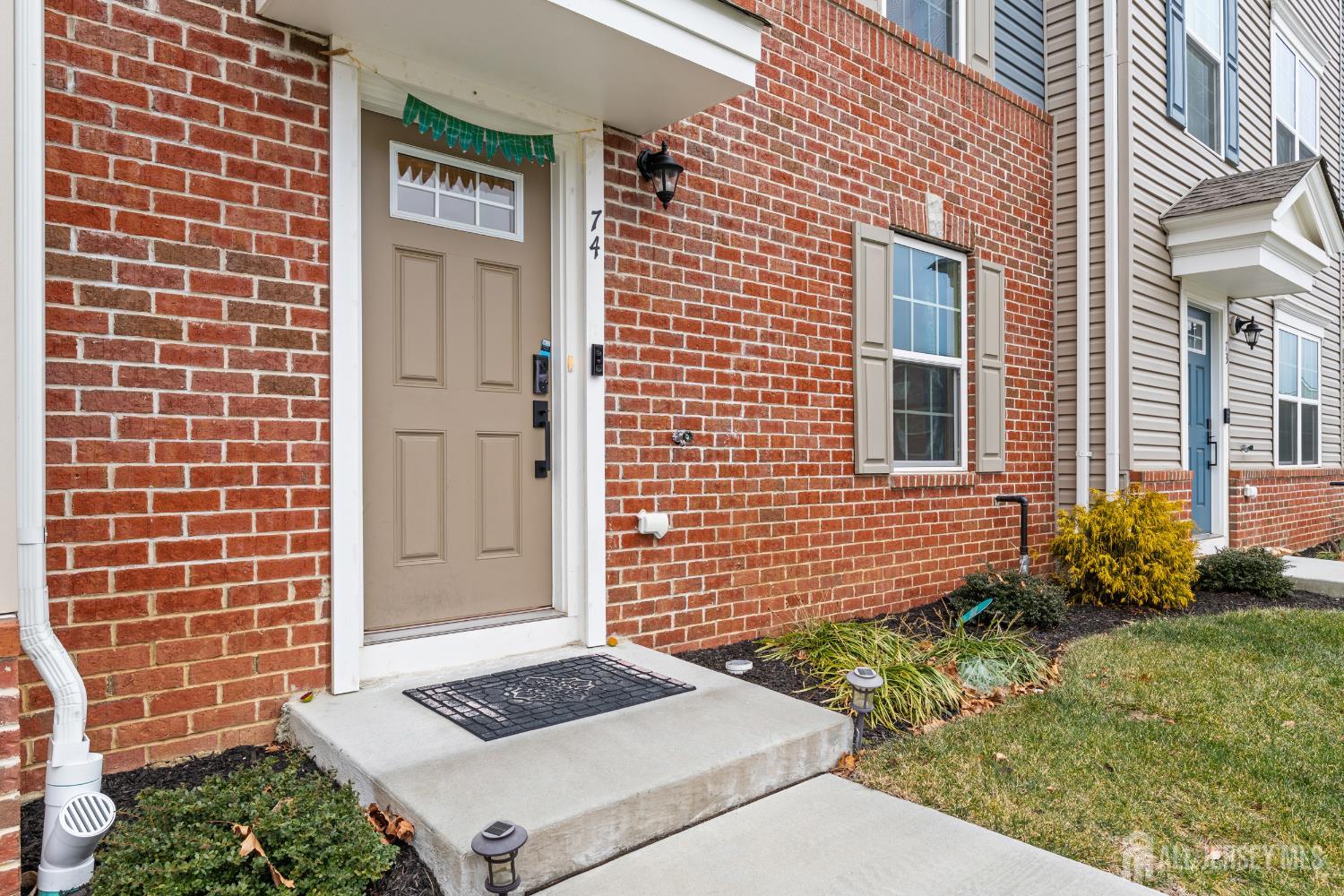 74 Anchor Way Cliffwood, NJ 07721 - Photo 3 of 35 a front view of a house with garden