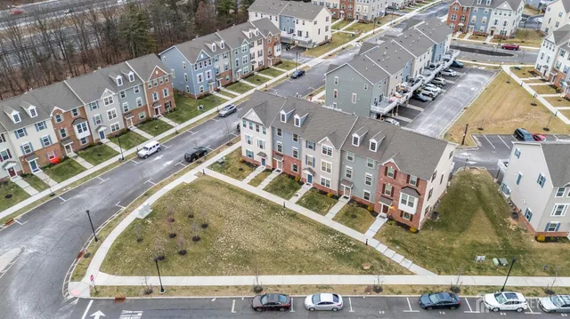 a front view of a house with a parking space