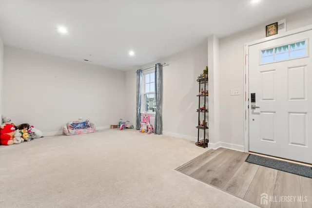 a kitchen with refrigerator and cabinets