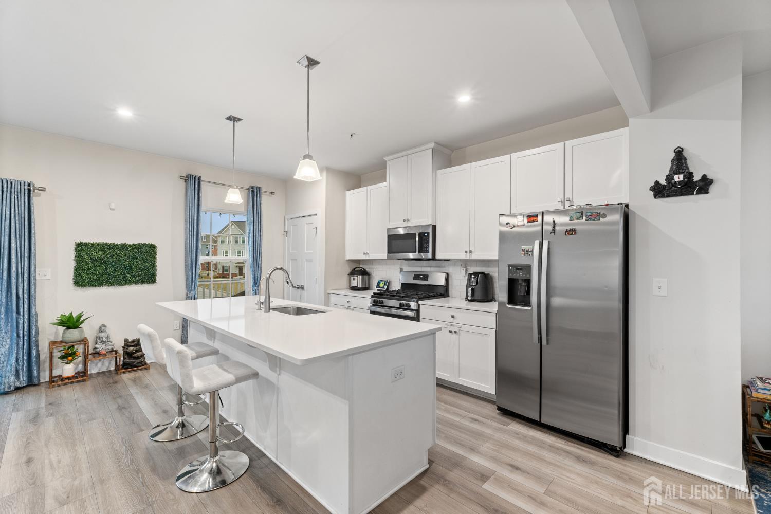 74 Anchor Way Cliffwood, NJ 07721 - Photo 9 of 35 a kitchen with refrigerator and cabinets