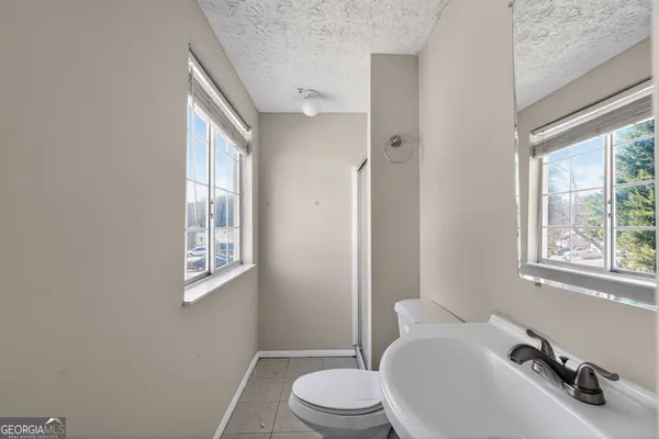a bathroom with a sink toilet and a tub