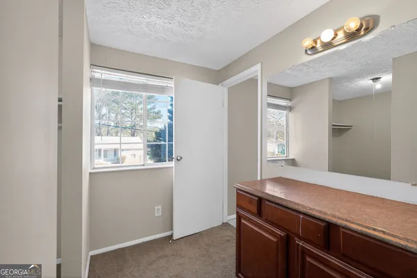 a room with wooden floor and window
