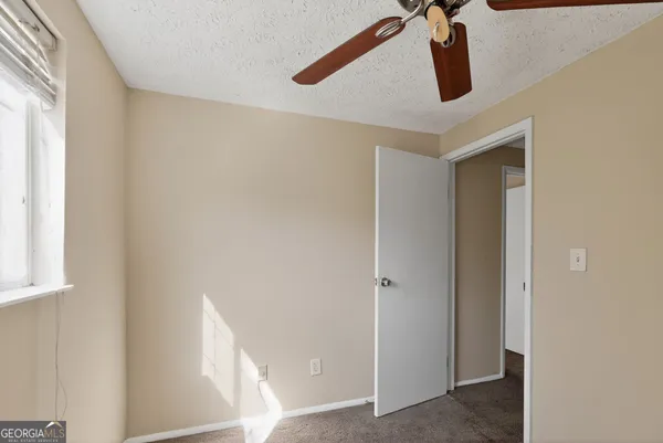 a view of walk in closet with window
