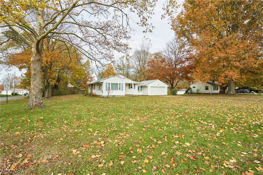 2941 Sweitzer Road Uniontown, OH 44685 - Photo 15 of 16 View of front of house featuring a front yard and a detached garage