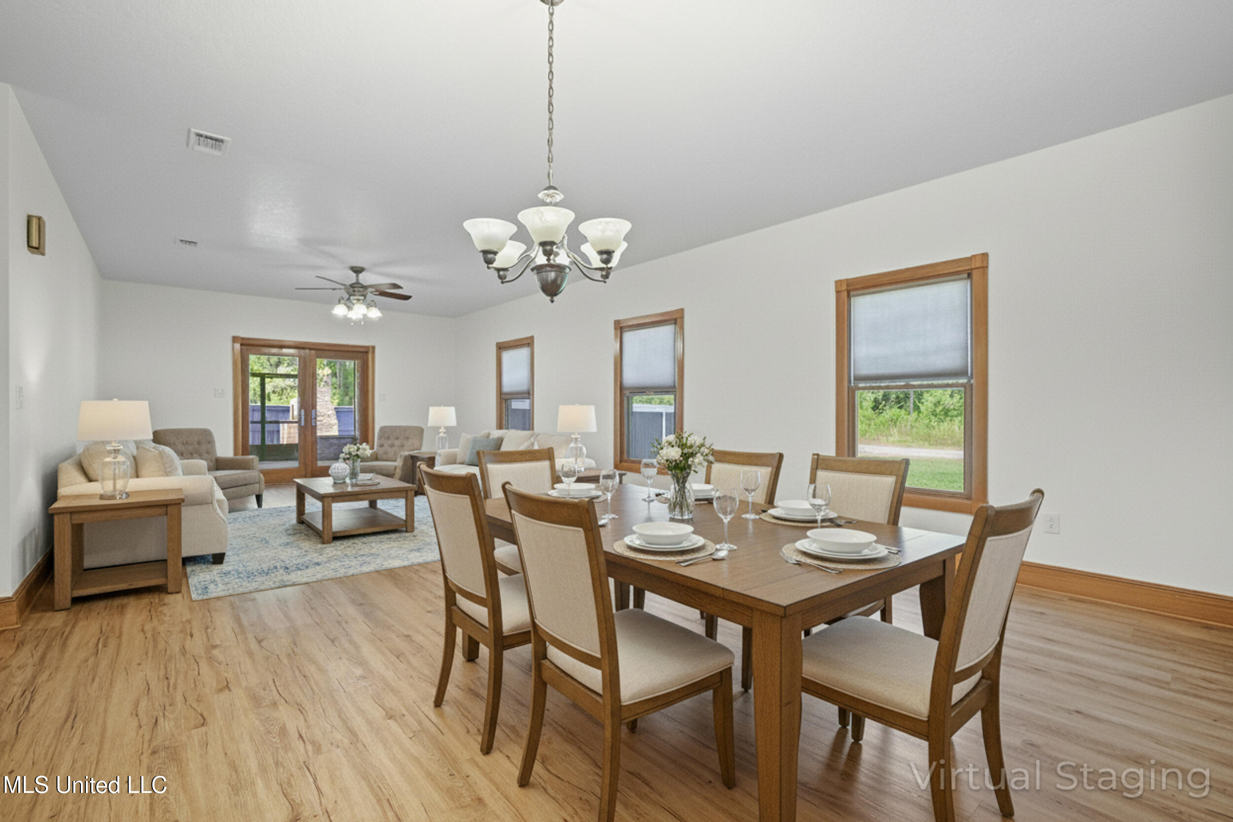 15301 Parker Road Biloxi, MS 39532 - Photo 19 of 67 FORMAL DINING AND FAMILY AREA STAGED