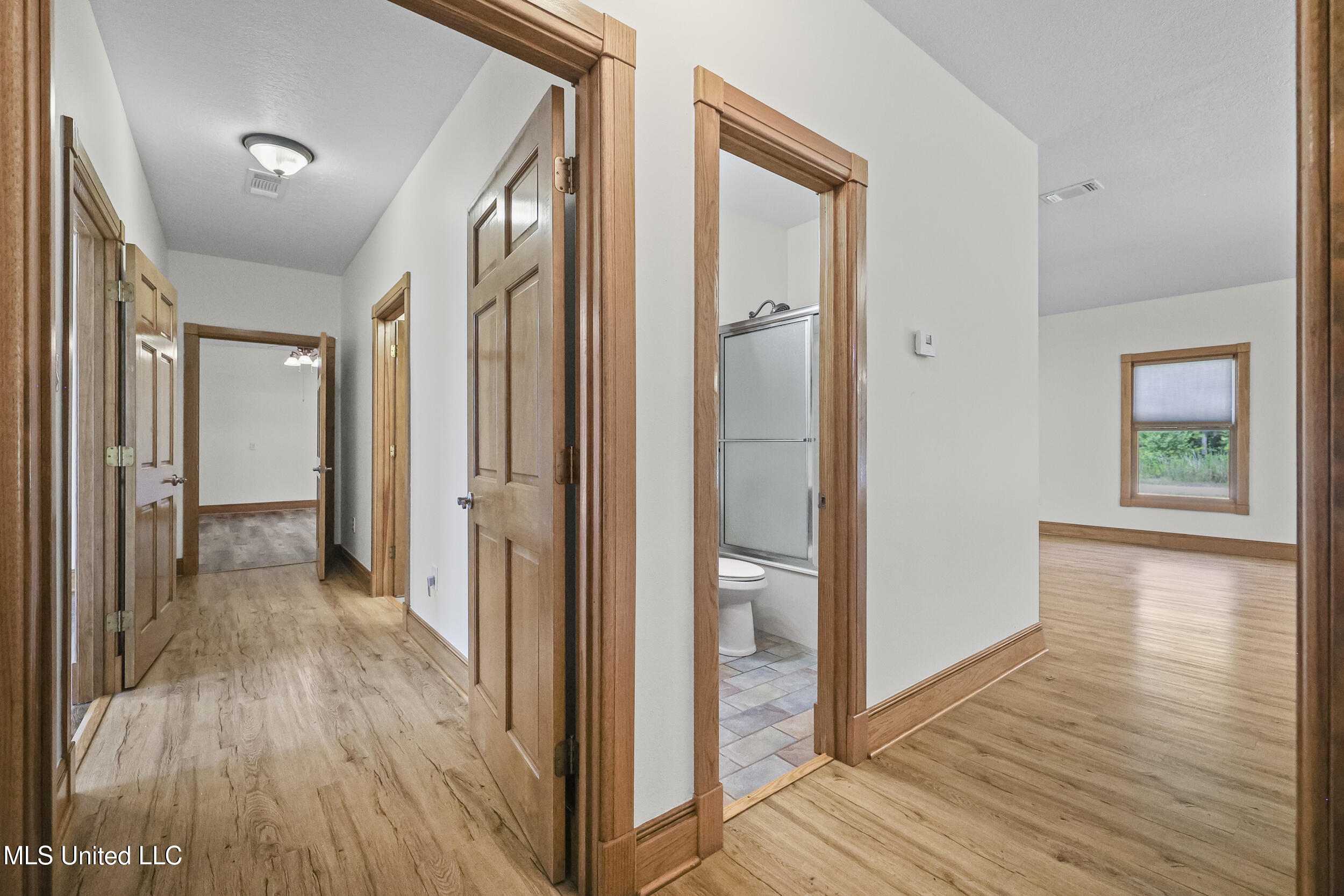 15301 Parker Road Biloxi, MS 39532 - Photo 30 of 67 GUEST HALF BATH AND HALL TO BEDROOMS