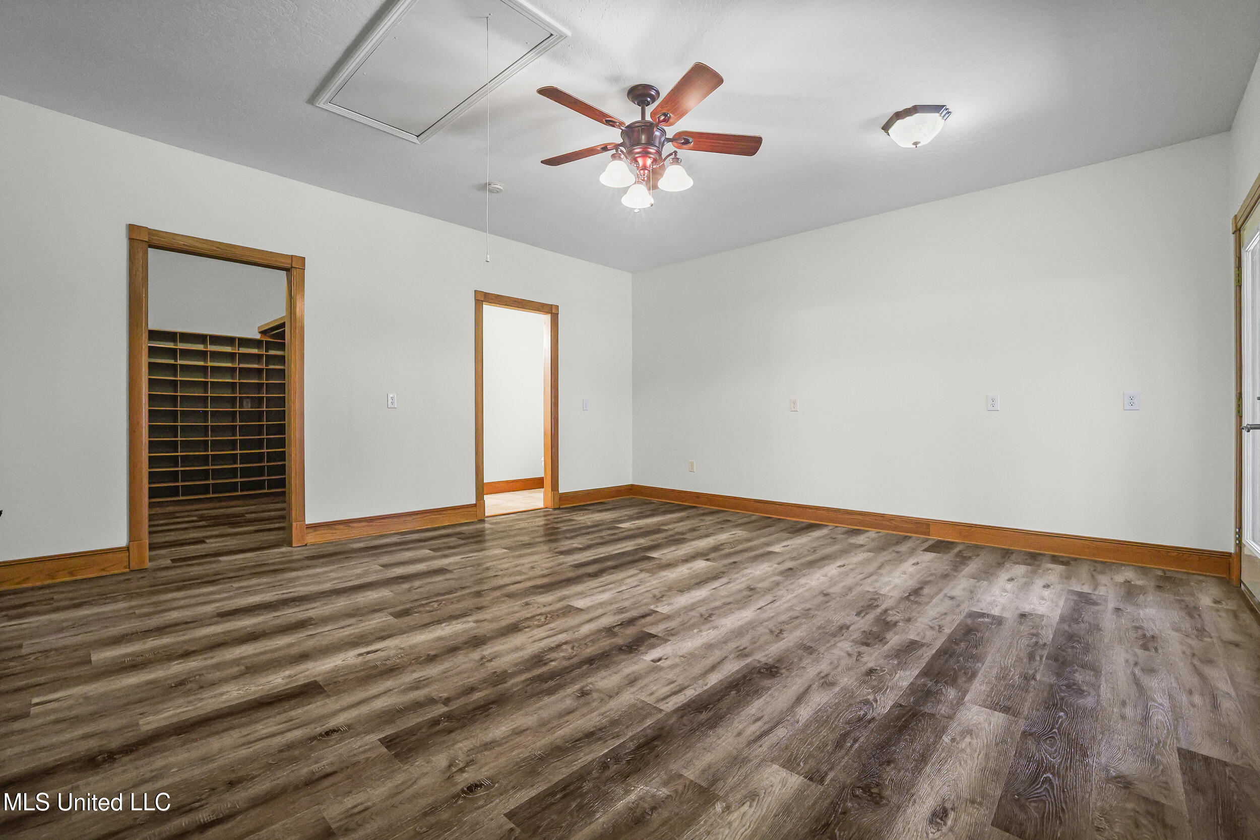 15301 Parker Road Biloxi, MS 39532 - Photo 37 of 67 PRIMARY BEDROOM CLOSET AND BATH ENTRY