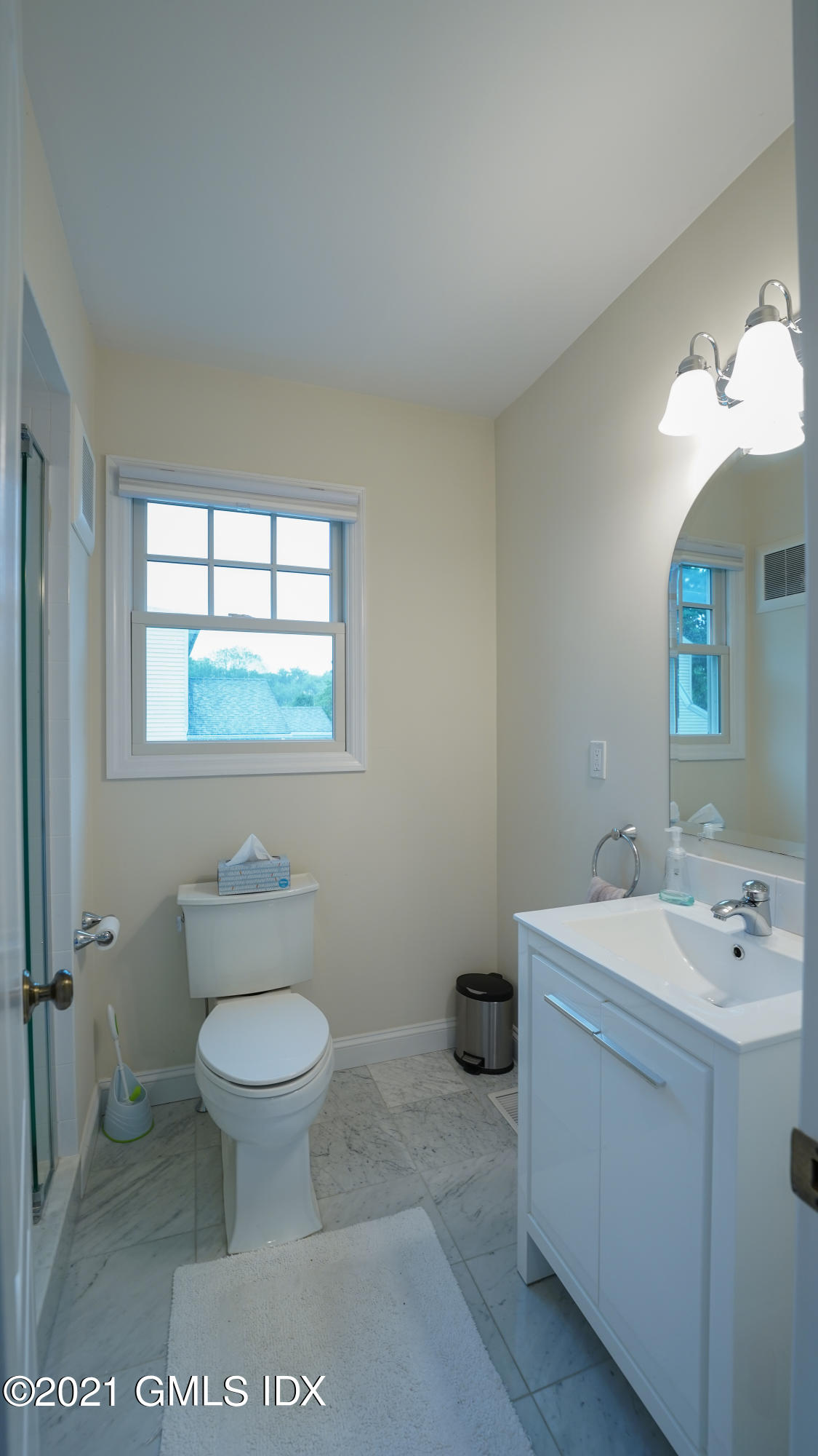 20 Sunshine Avenue Riverside, CT 06878 - Photo 20 of 39 a bathroom with a sink toilet and window