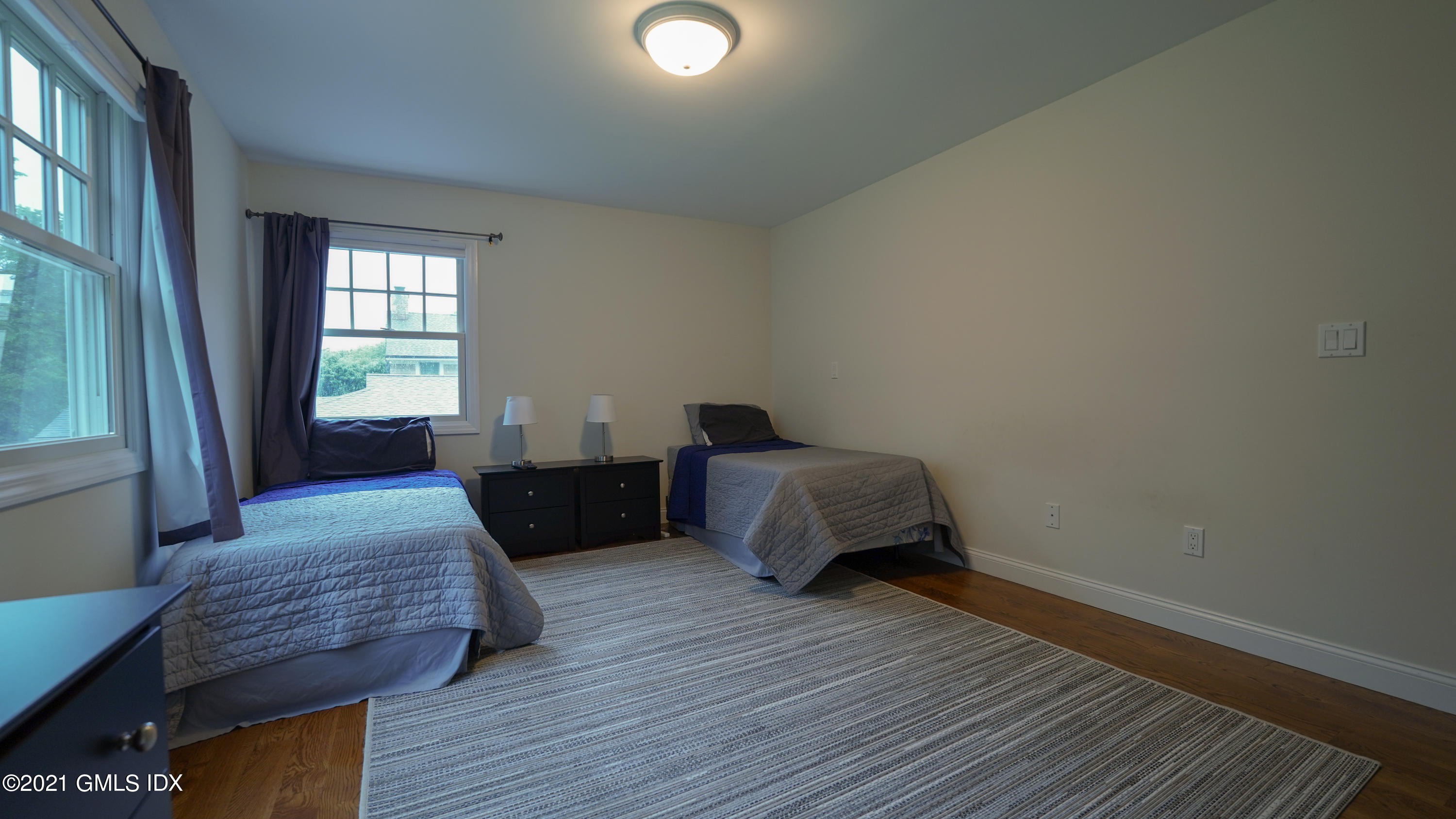 20 Sunshine Avenue Riverside, CT 06878 - Photo 36 of 39 a bedroom with a bed and wooden floor
