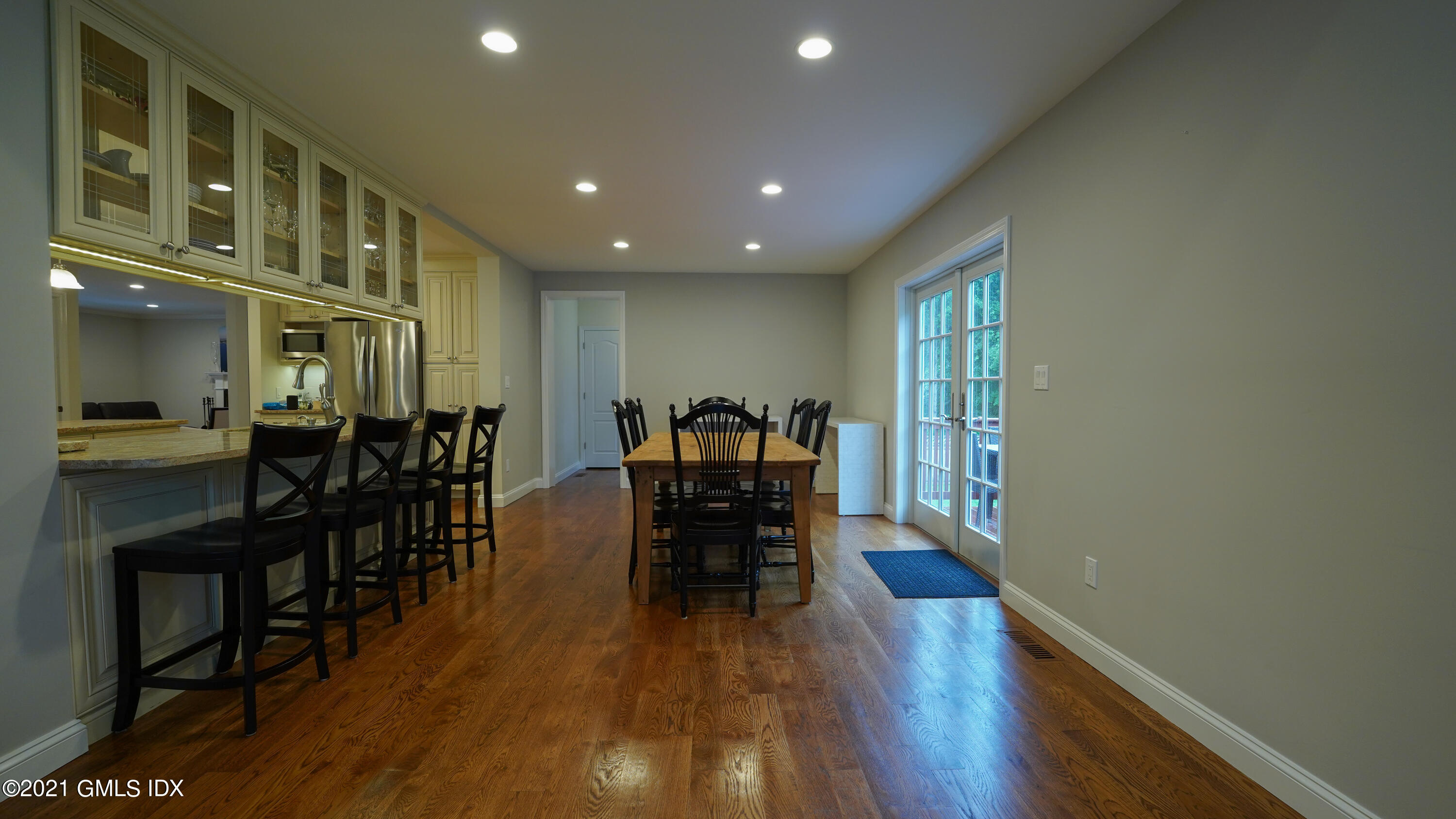 20 Sunshine Avenue Riverside, CT 06878 - Photo 4 of 39 a dining room with furniture wooden floor and a floor to ceiling window