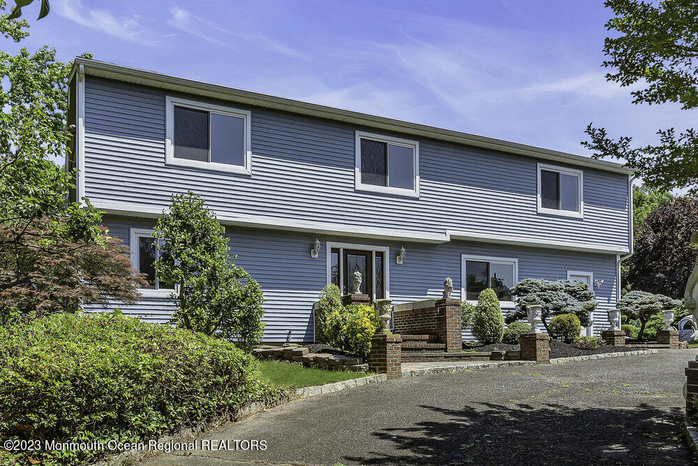77 Farrington Road Old Bridge, NJ 07747 - Photo 1 of 33 a front view of a house with sitting area