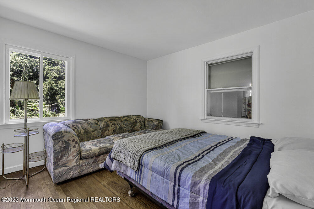77 Farrington Road Old Bridge, NJ 07747 - Photo 12 of 33 a bedroom with a bed and a couch