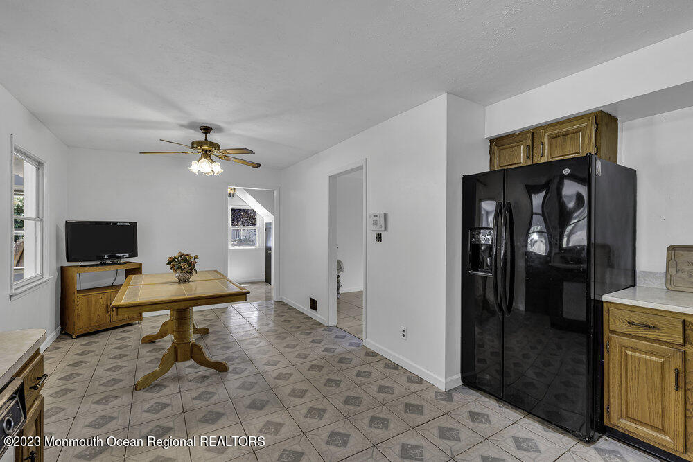 77 Farrington Road Old Bridge, NJ 07747 - Photo 18 of 33 a living room with furniture and a flat screen tv