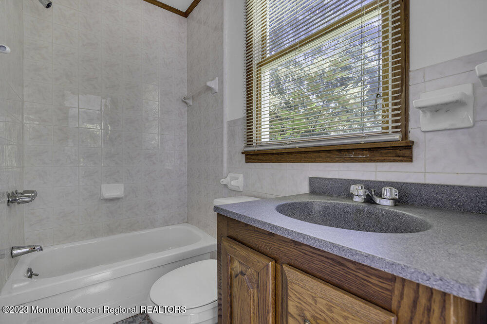 77 Farrington Road Old Bridge, NJ 07747 - Photo 20 of 33 a bathroom with a sink a toilet and bathtub