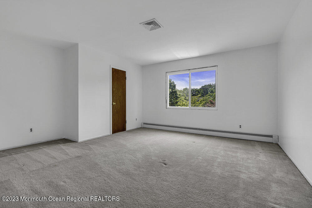 77 Farrington Road Old Bridge, NJ 07747 - Photo 24 of 33 an empty room with windows and closet