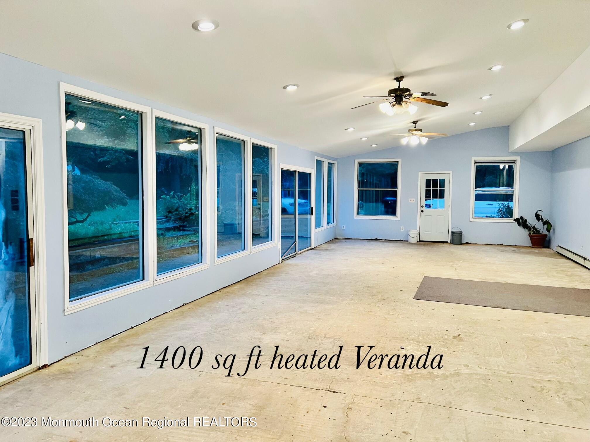 77 Farrington Road Old Bridge, NJ 07747 - Photo 27 of 33 a view of a hall with a window and a ceiling fan
