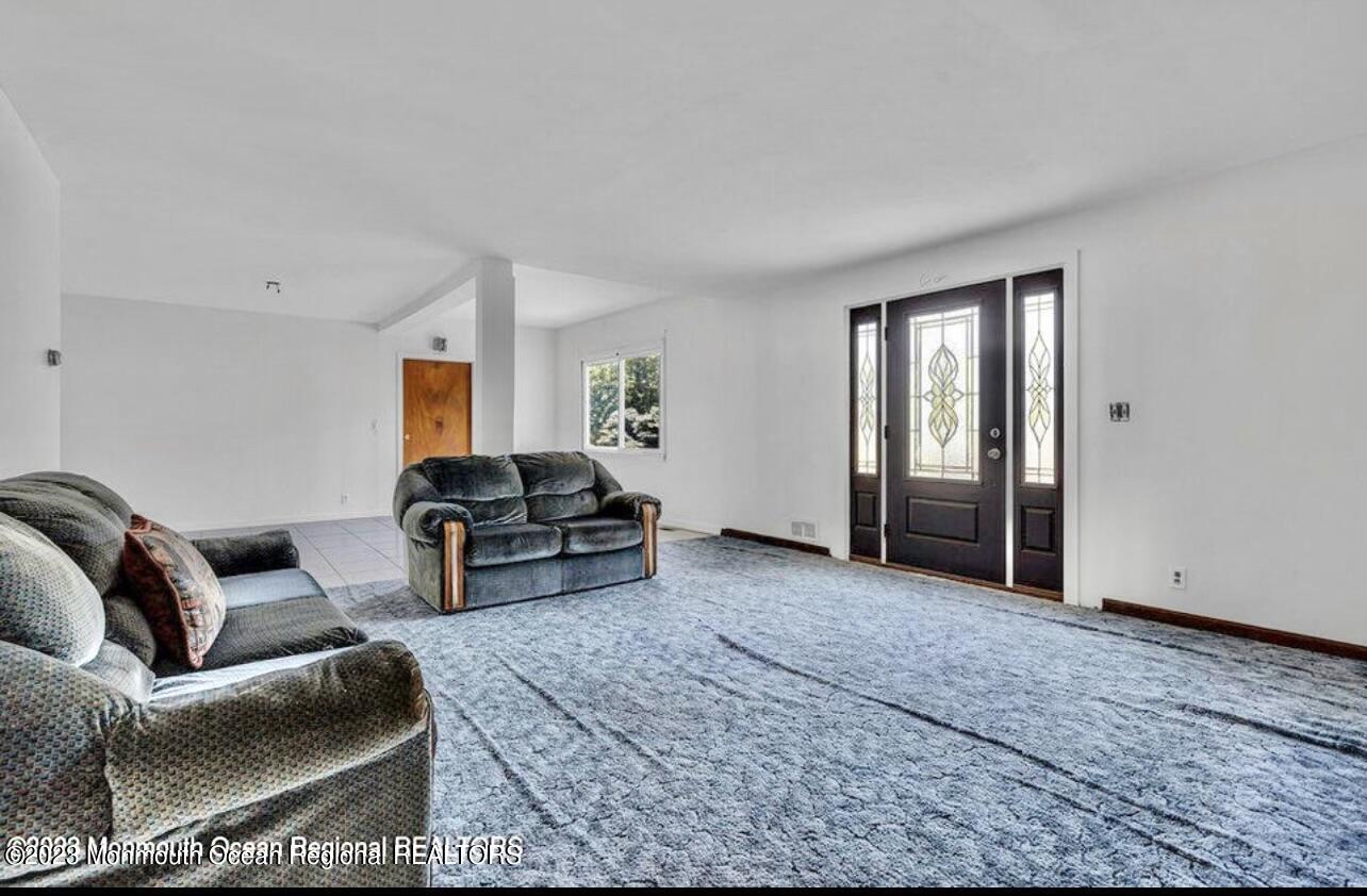 77 Farrington Road Old Bridge, NJ 07747 - Photo 30 of 33 a living room with furniture and a window