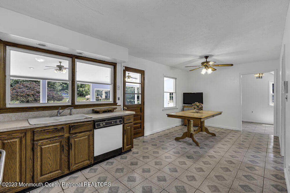 77 Farrington Road Old Bridge, NJ 07747 - Photo 7 of 33 a kitchen with a sink and a stove