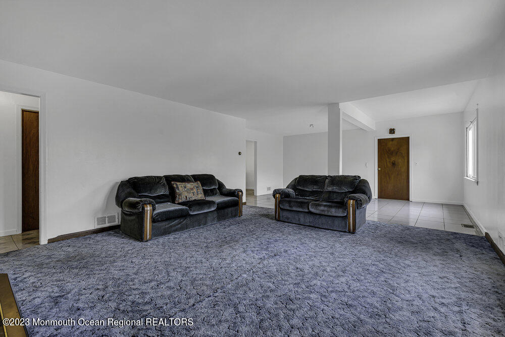 77 Farrington Road Old Bridge, NJ 07747 - Photo 10 of 33 a living room with furniture and a couch