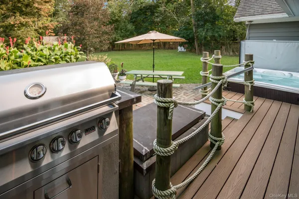 a view of a patio with chairs and a table