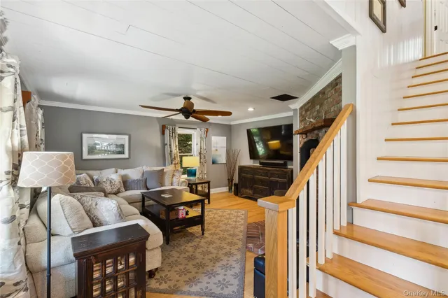 a kitchen with stainless steel appliances granite countertop a stove top oven a dining table and chairs