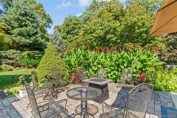 a view of a backyard with sitting area