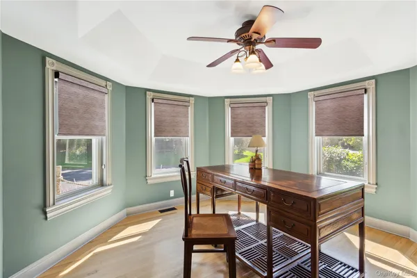 a workspace with furniture and a window