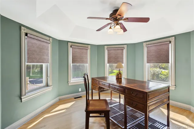 a bedroom with a bed couch and a window