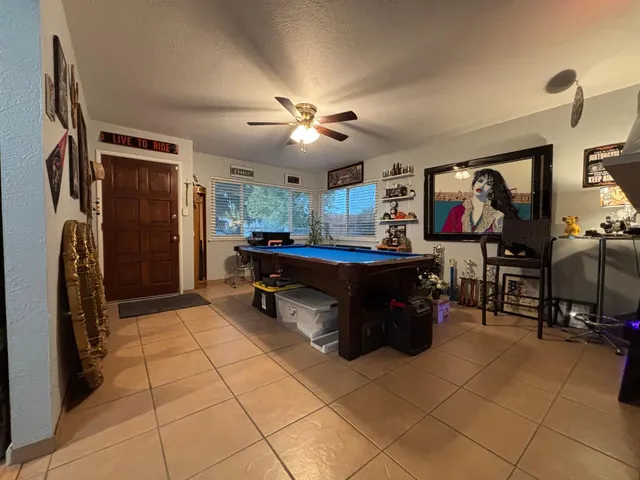 a room with a cabinets and flat screen tv