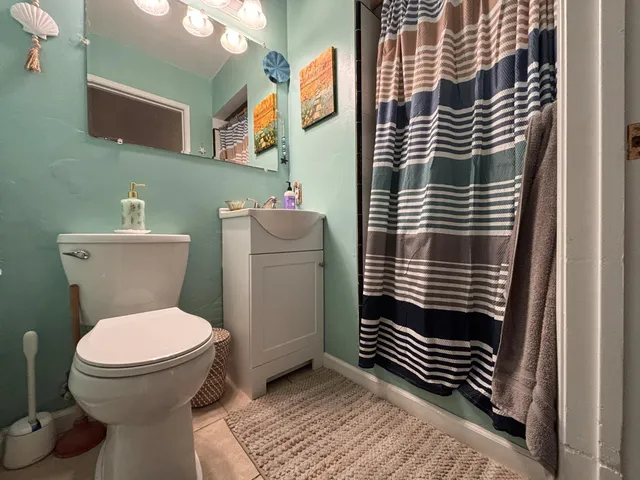 a bathroom with a toilet and a sink