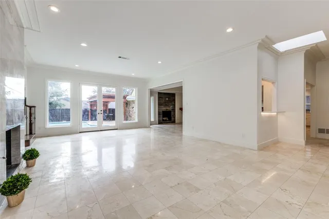 a view of an empty room and natural light