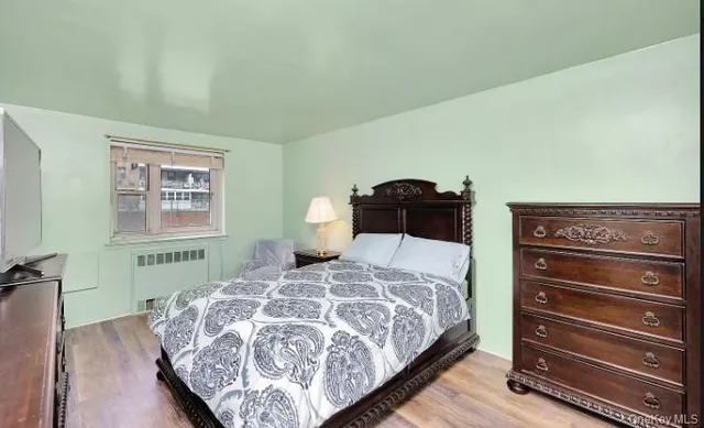 a bedroom with a bed and a closet