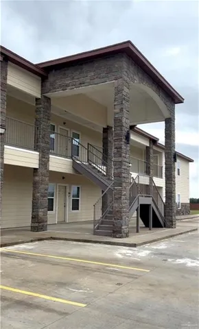 a front view of a house with a garage
