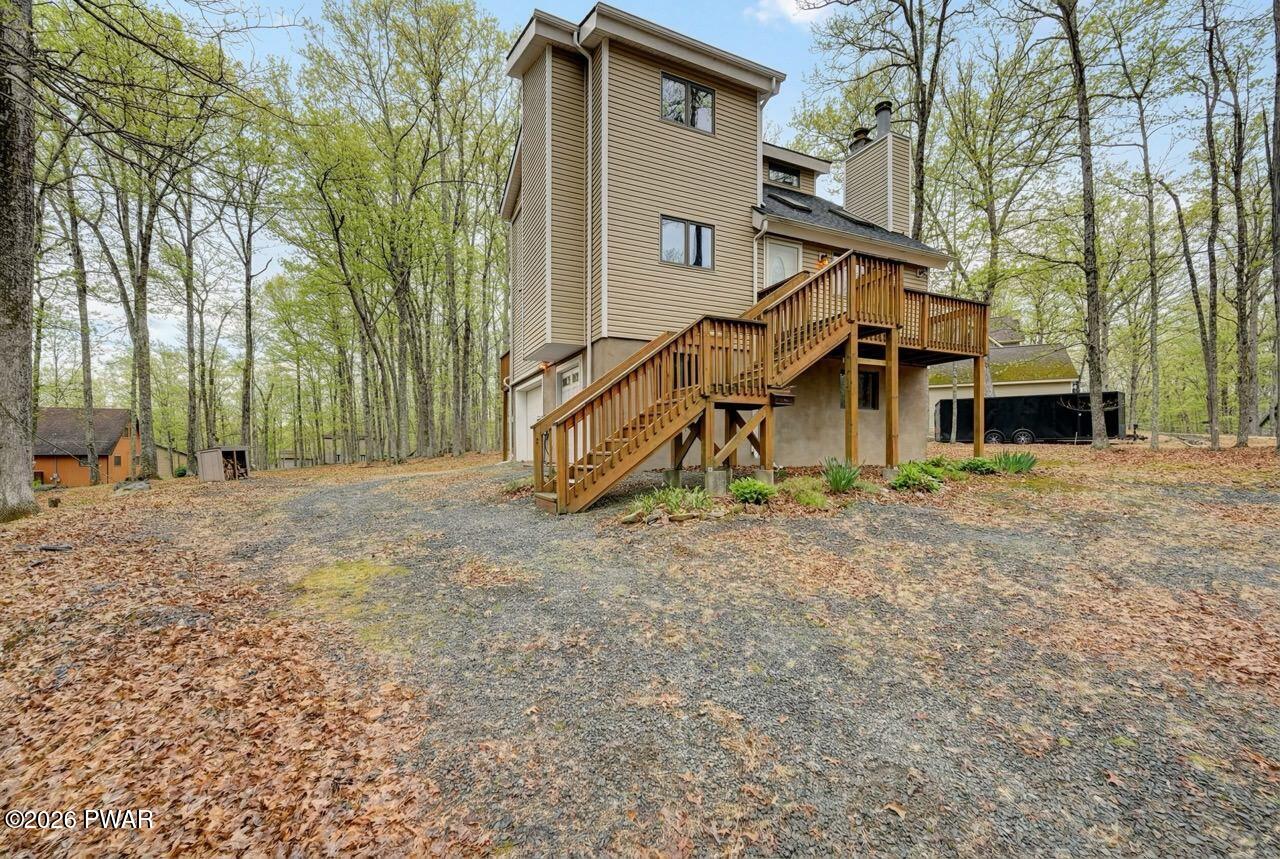 258 Lakeview Road Lackawaxen, PA 18435 - Photo 11 of 119 a view of a house with a yard and wooden fence