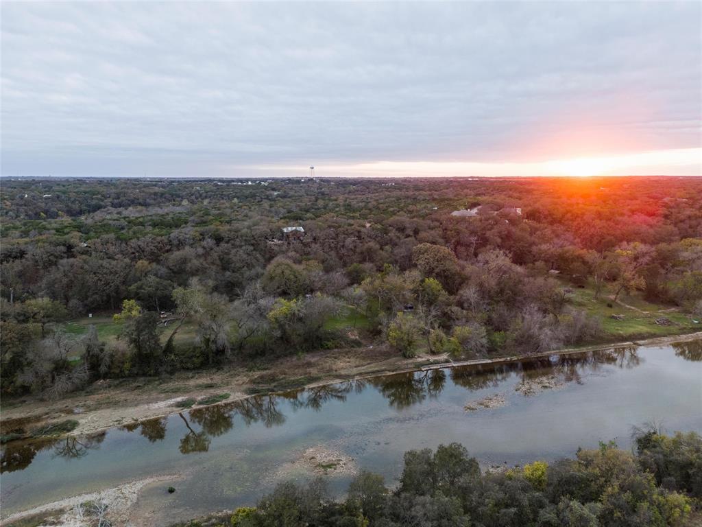 1307 Range Road China Spring, TX 76633 - Photo 2 of 40 an aerial view of a city with mountains