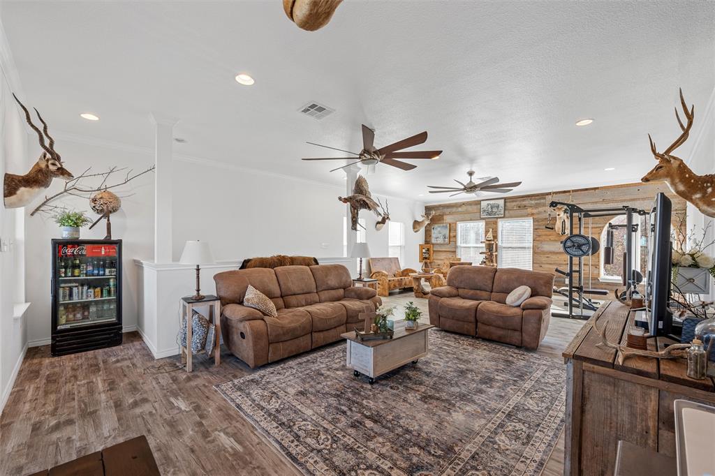 1307 Range Road China Spring, TX 76633 - Photo 23 of 40 a living room with furniture and a flat screen tv