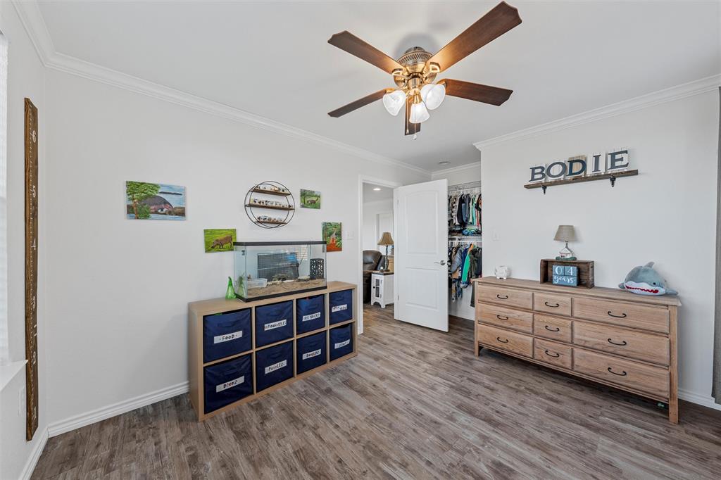 1307 Range Road China Spring, TX 76633 - Photo 27 of 40 a living room with furniture and paintings on the wall