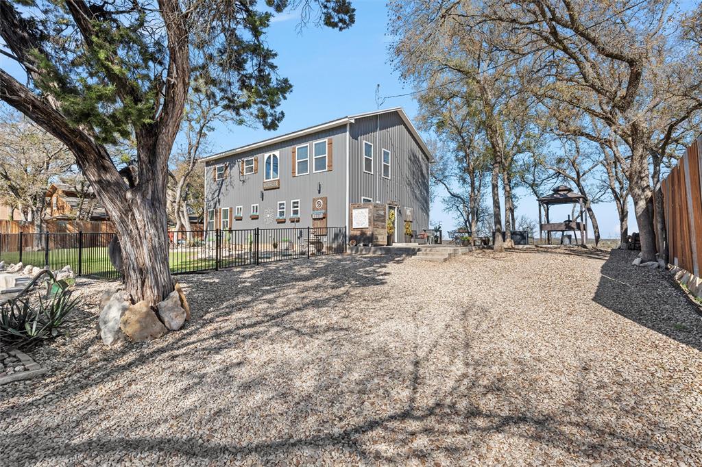 1307 Range Road China Spring, TX 76633 - Photo 30 of 40 a large tree in front of a house