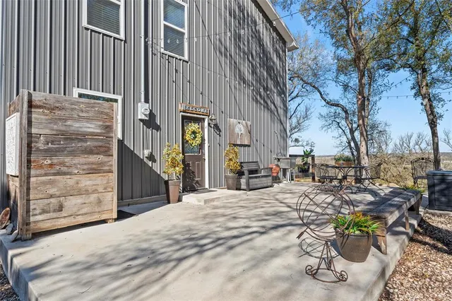 a view of a backyard with sitting area