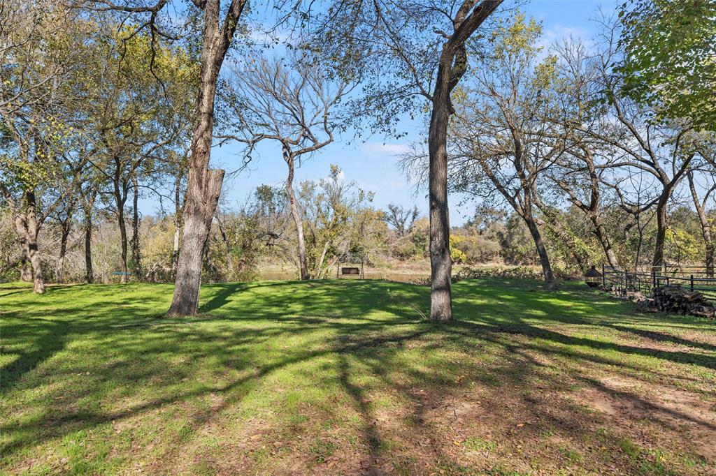 1307 Range Road China Spring, TX 76633 - Photo 40 of 40 a large yard with lots of green space and trees
