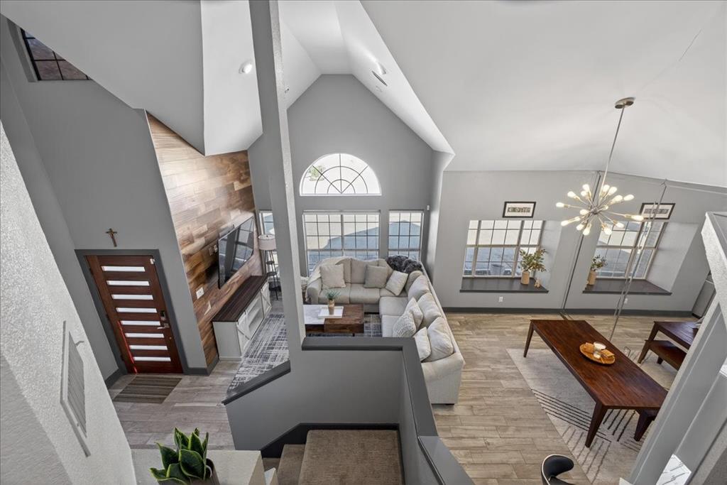 2934 North Bend Drive Dallas, TX 75229 - Photo 11 of 30 a living room with fireplace furniture and a chandelier