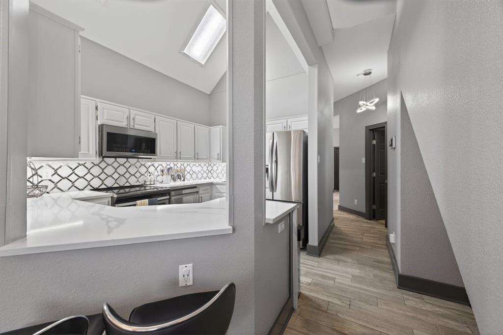 2934 North Bend Drive Dallas, TX 75229 - Photo 17 of 30 a bathroom with a sink and a mirror
