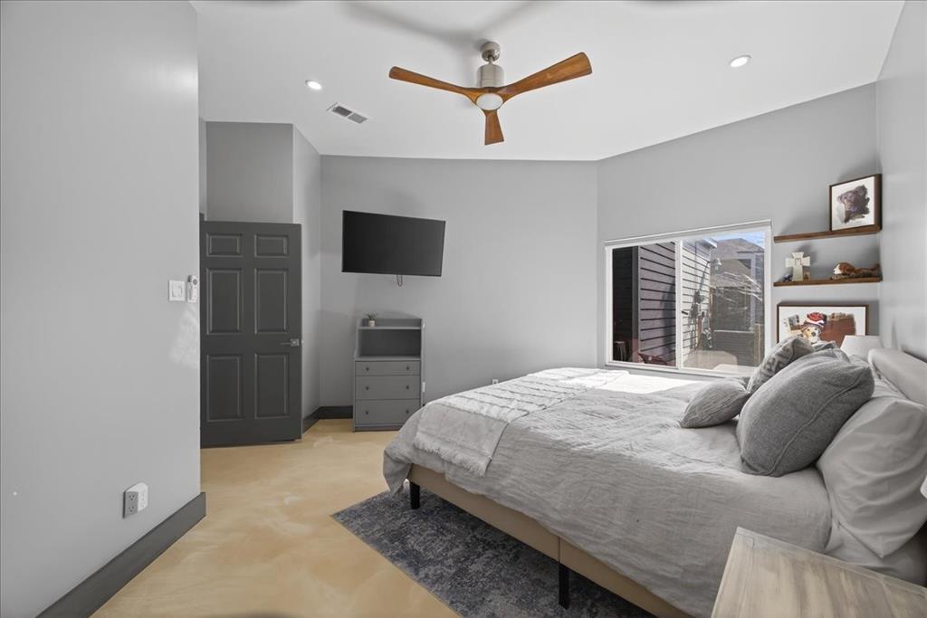 2934 North Bend Drive Dallas, TX 75229 - Photo 22 of 30 a bedroom with a bed and a flat screen tv