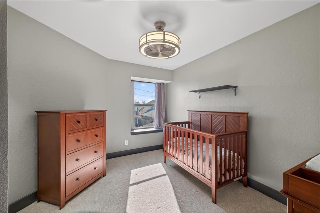 2934 North Bend Drive Dallas, TX 75229 - Photo 27 of 30 a view of a bedroom with furniture and windows