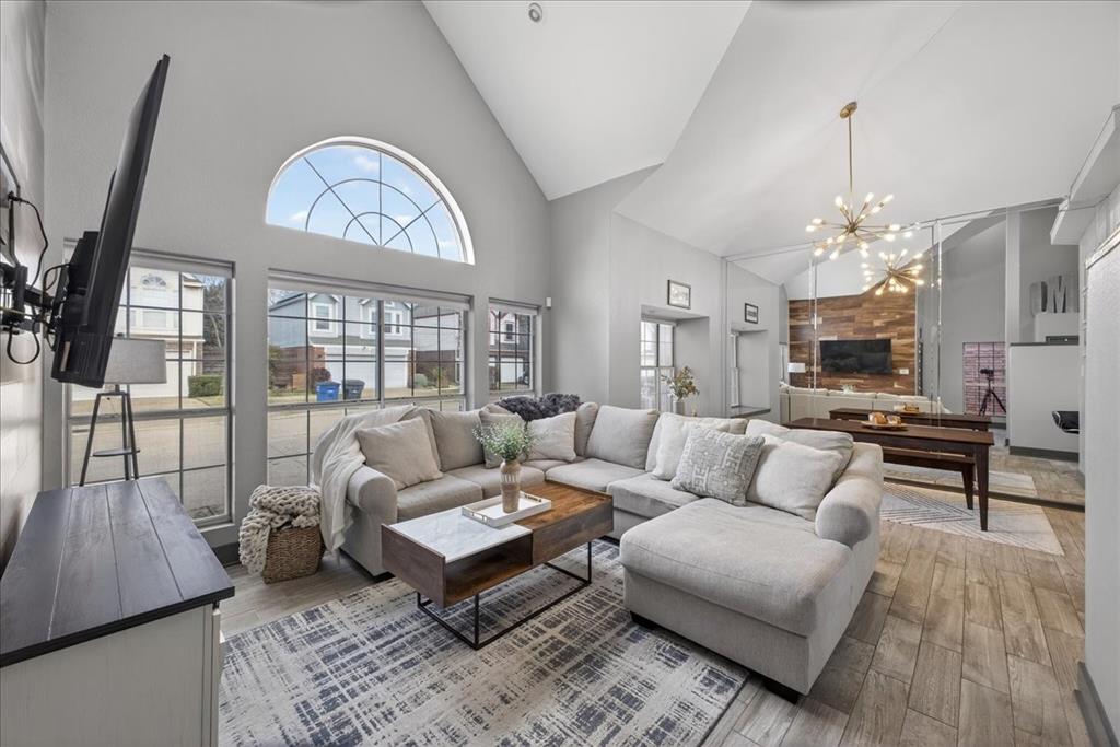 2934 North Bend Drive Dallas, TX 75229 - Photo 8 of 30 a living room with furniture a chandelier and a large mirror