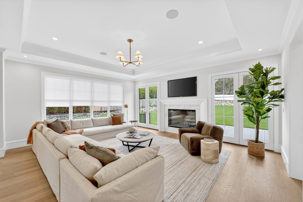 8 Crestview Road Needham, MA 02492 - Photo 7 of 30 a living room with furniture a fireplace and a potted plant